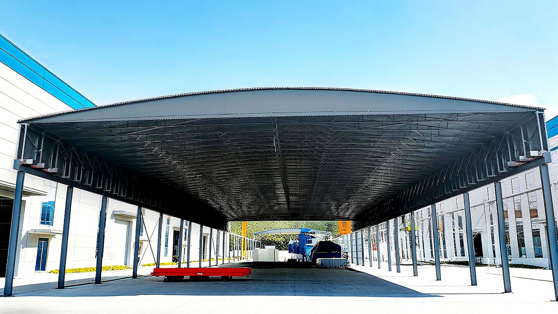 Factory loading area — suspended electric retractable canopy front view