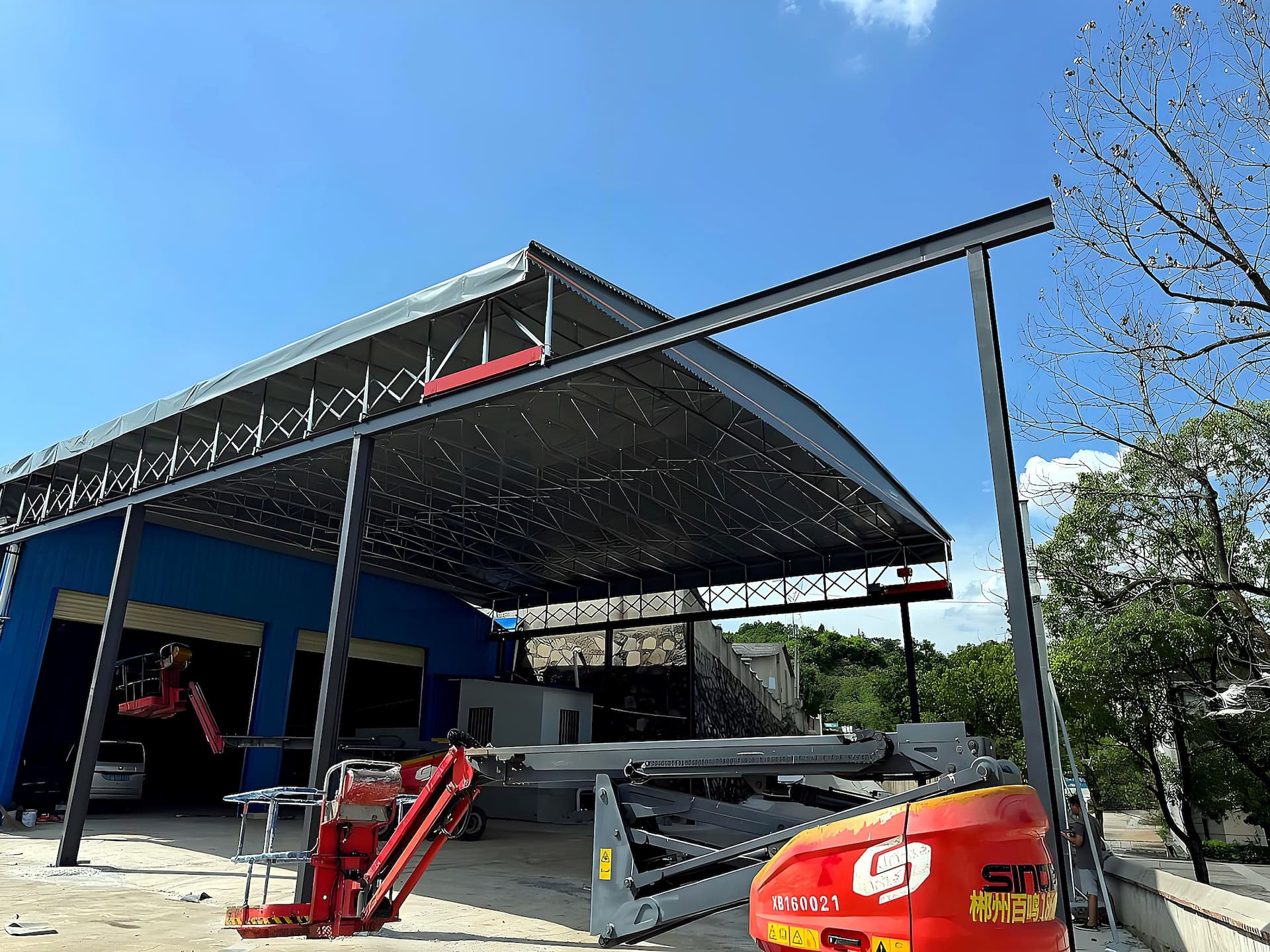 Infrastructure site — large-span ground-mounted electric canopy open yard